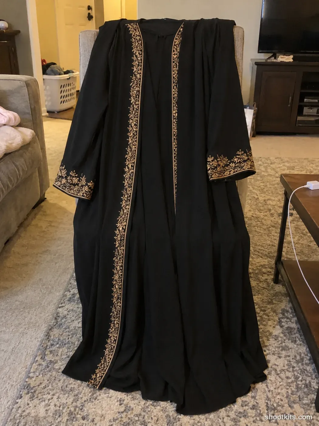 Before: a casual phone photo of an embroidered abaya